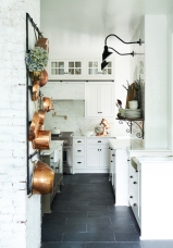 Complete antique copper collection, antique iron brackets, antique ironstone bowl and accessories in glass cabinets from: Garden Style Living / Pictured from: HGTV's Restored by the Fords / Design: Leanne Ford Interiors / Photo: Alexandra Ribar
